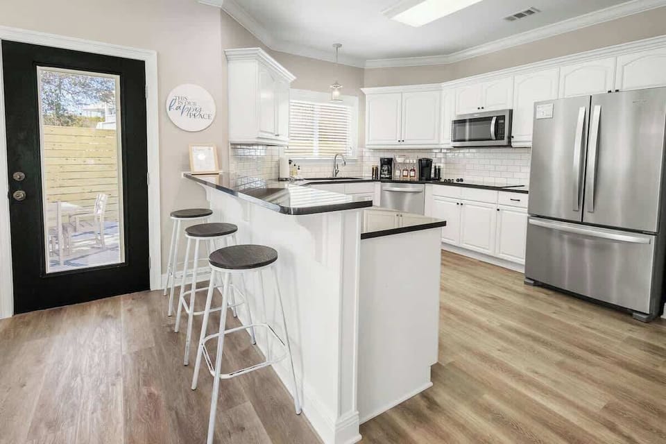 Kitchen island includes an 3 additional 3 seats.