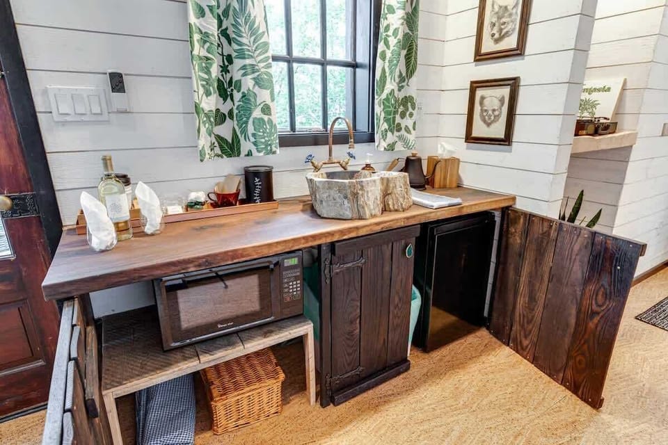 Our kitchenette has a microwave, mini fridge, picnic basket, coffee, tea, water, wine, and more!