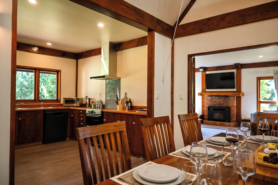 Watch the smart TV from the full size dining table, or look at the lake view 