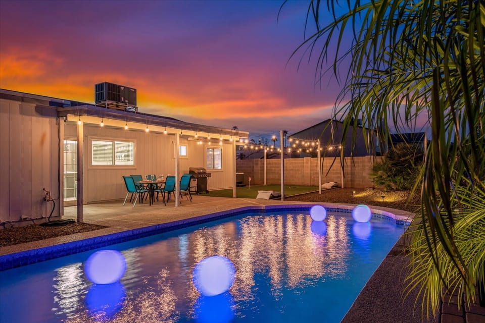 Experience the magic of our backyard at night with poolside dining and charming string lights