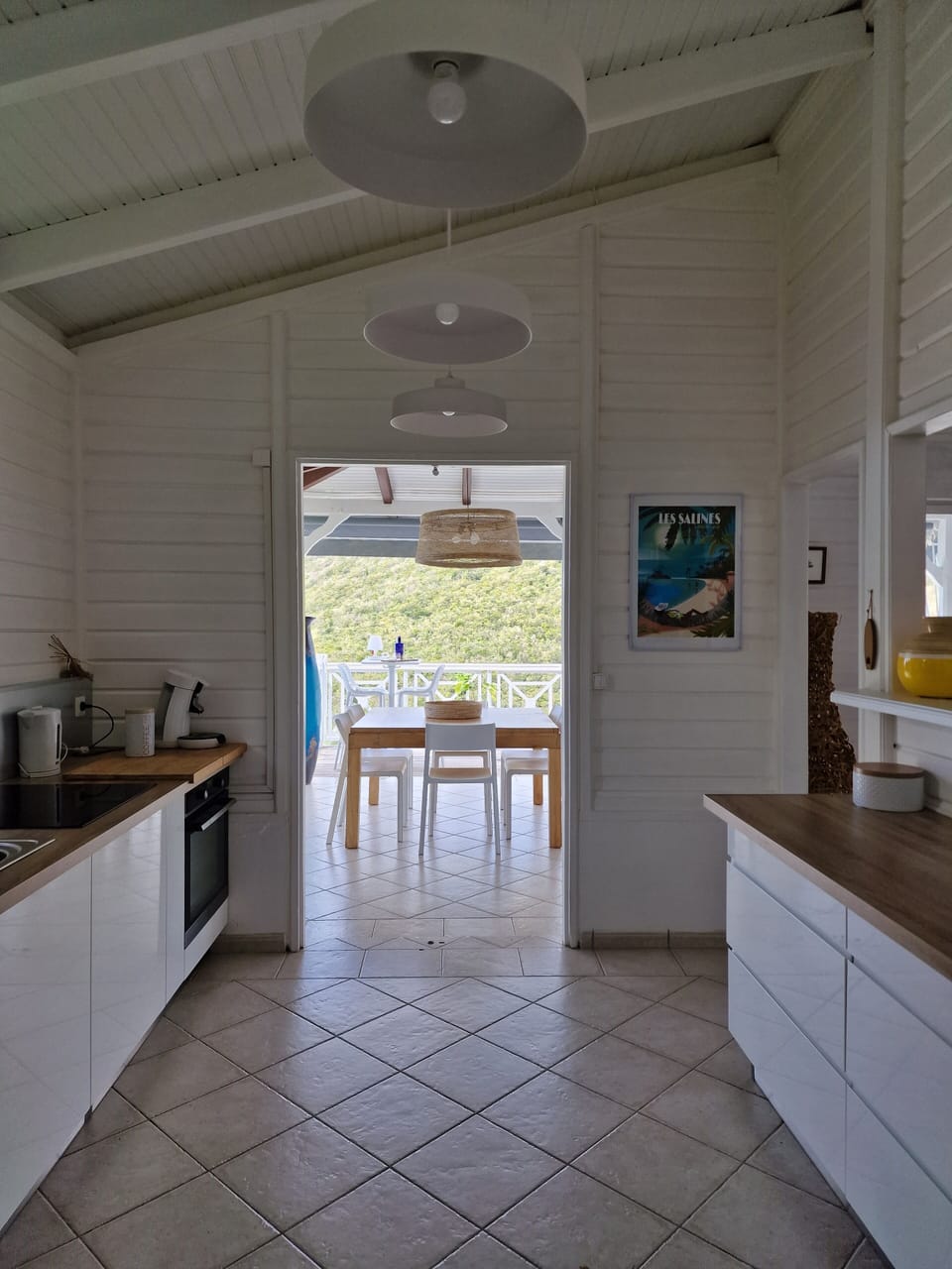 kitchen with view of dining area on terrace 