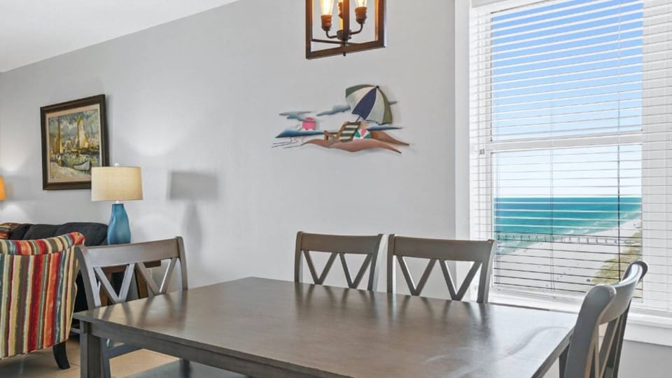 Gather around your dining table with stunning sea views streaming through the windows, creating the perfect backdrop for memorable meals together.