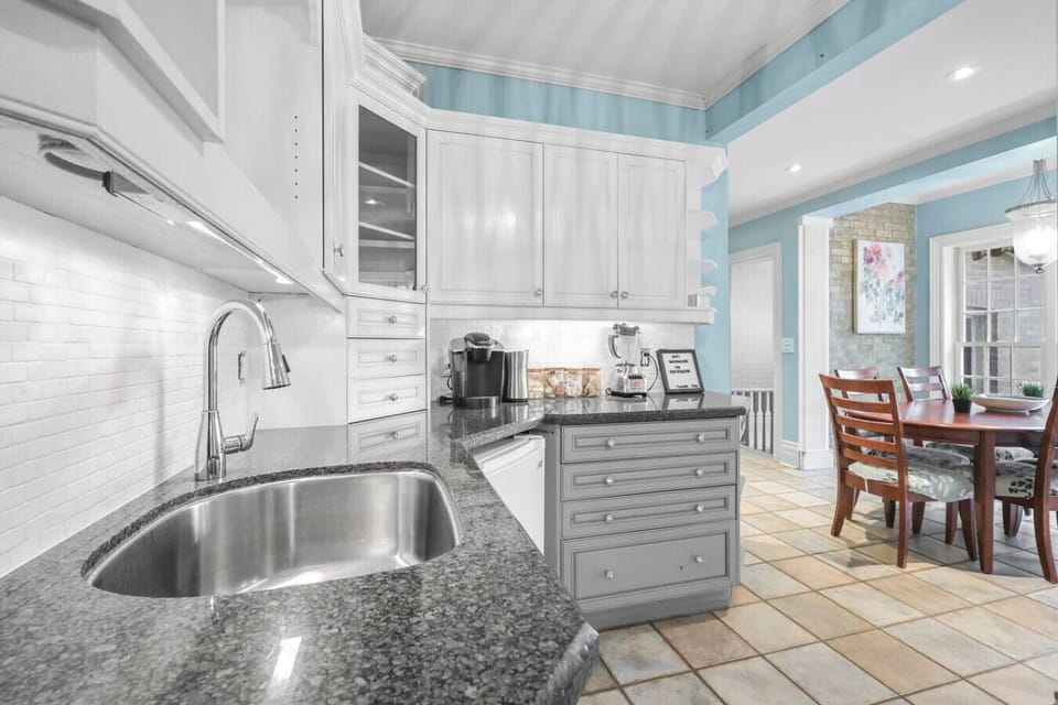 Gather at the heart of the home. Our kitchen features a large granite countertop, a blender, and a Keurig, ensuring you have everything you need to feel at home.