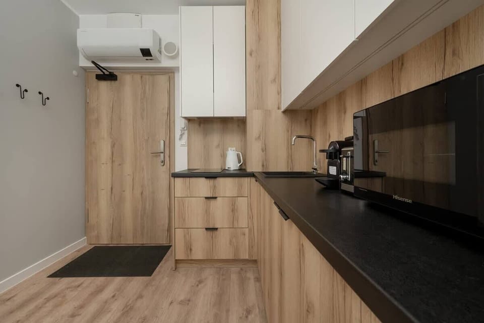 Kitchenette with a washing machine.