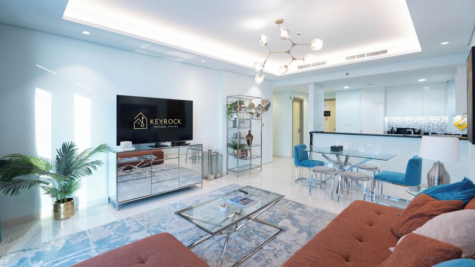 Deluxe Apartment, 2 Bedrooms, Balcony, City View | Living area | 65-inch flat-screen TV with digital channels