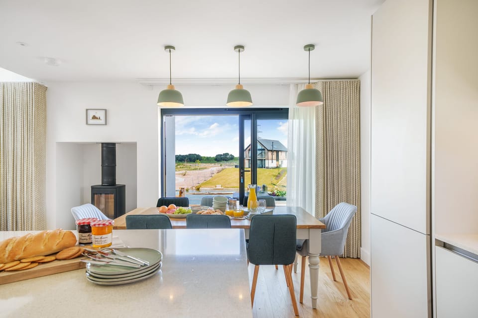 The Hide, Silverlake, Dorchester: A view of the island and dining area and out to the terrace