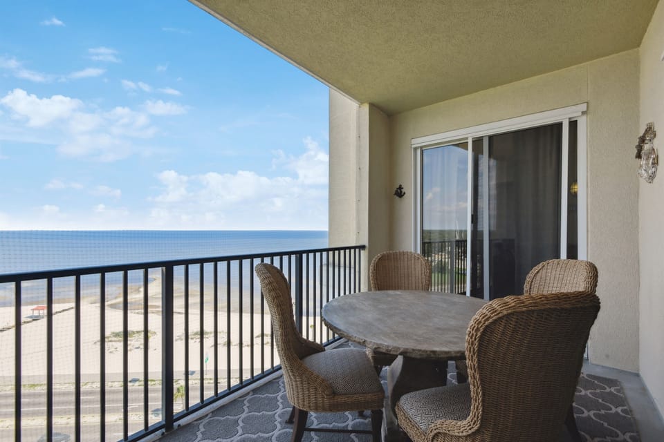 View from the balcony accessible from living room and primary bedroom. Dining table for 4.