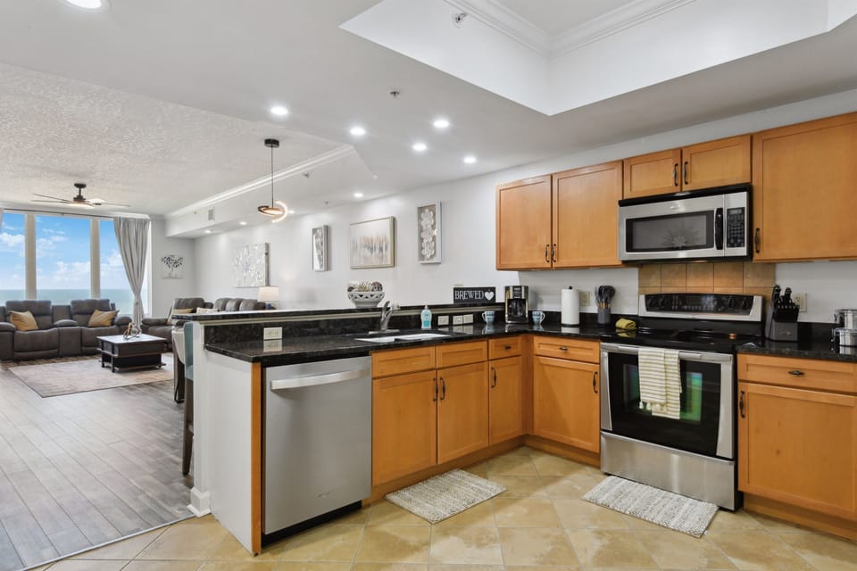 Full kitchen includes fridge w ice & water, dishwasher, oven range, microwave, pantry, disposal, etc.