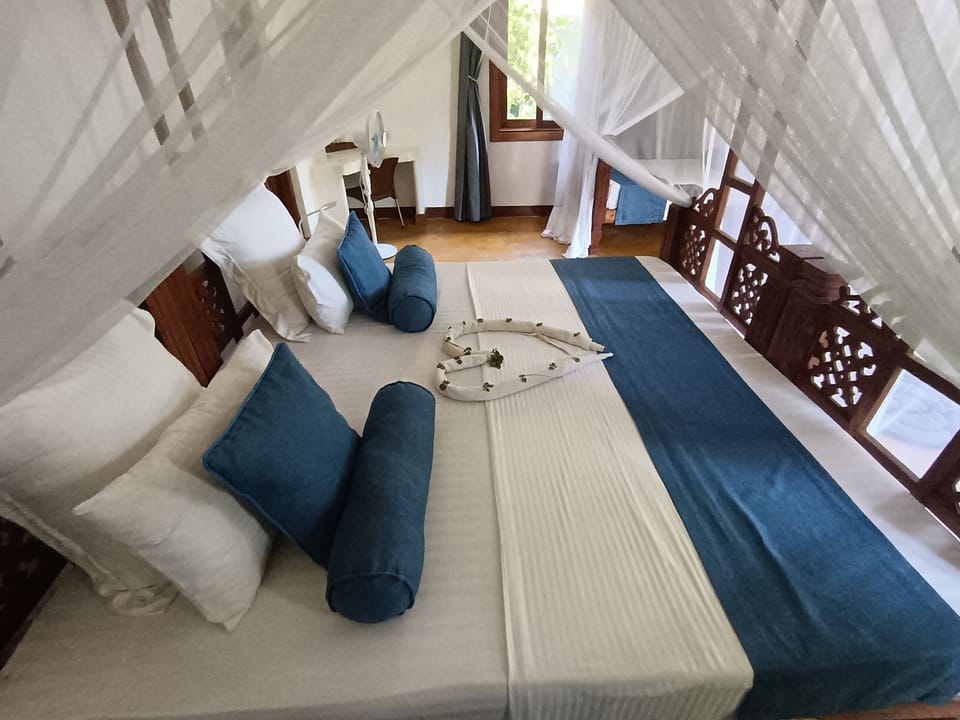 Deluxe Double Room, Balcony, Garden View | In-room safe, desk, laptop workspace, iron/ironing board