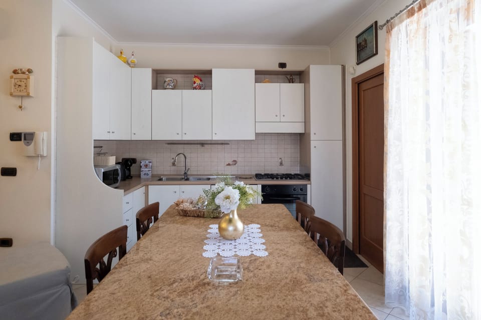 Deluxe Apartment | Private kitchen | Espresso maker, coffee/tea maker, full-size fridge, microwave
