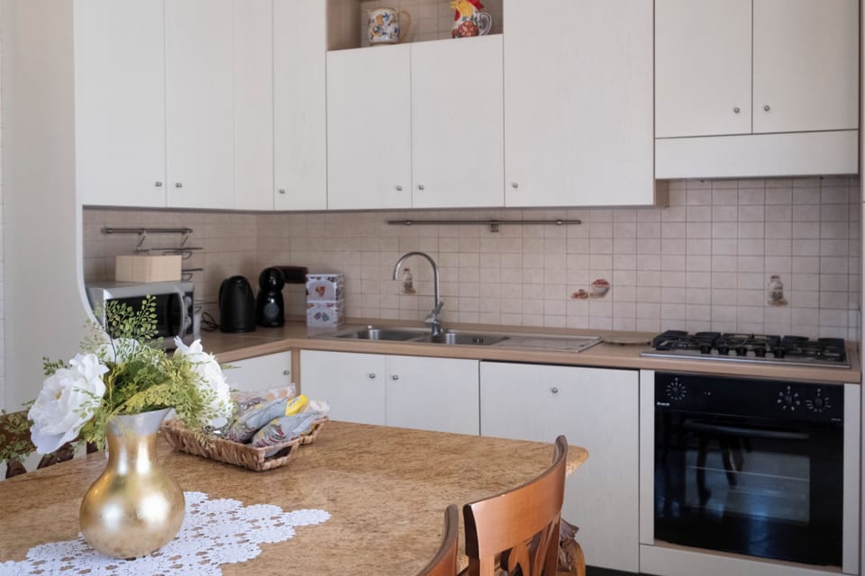 Deluxe Apartment | Private kitchen | Espresso maker, coffee/tea maker, full-size fridge, microwave