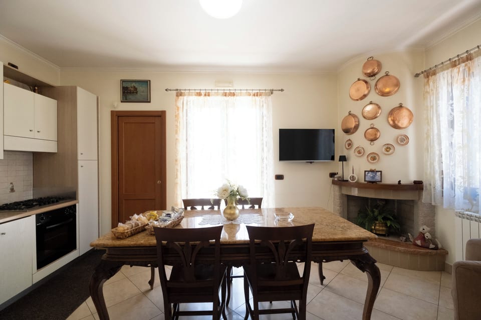 Deluxe Apartment | Private kitchen | Espresso maker, coffee/tea maker, full-size fridge, microwave