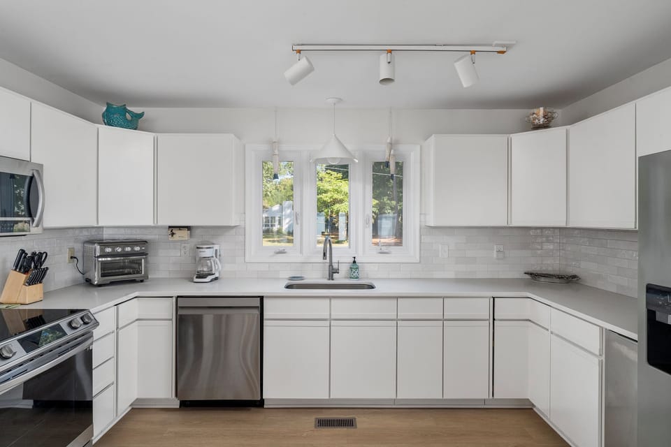 Gourmet Kitchen: Cook like a pro in this sleek space with modern appliances, plenty of natural light and of course fully stocked! 