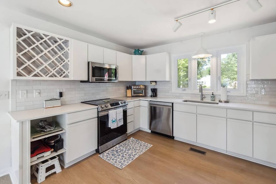 Kitchen: Bright, modern space with sleek appliances and views for culinary delights!