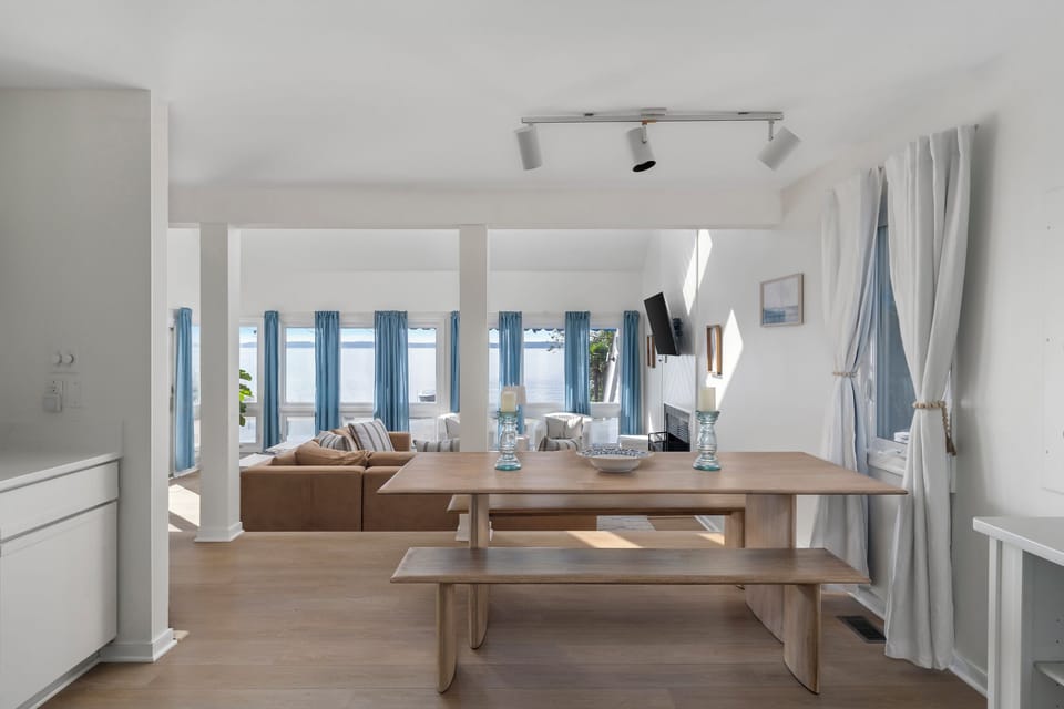 Dining Area: Bright views and stylish seating await your family meals by the water!