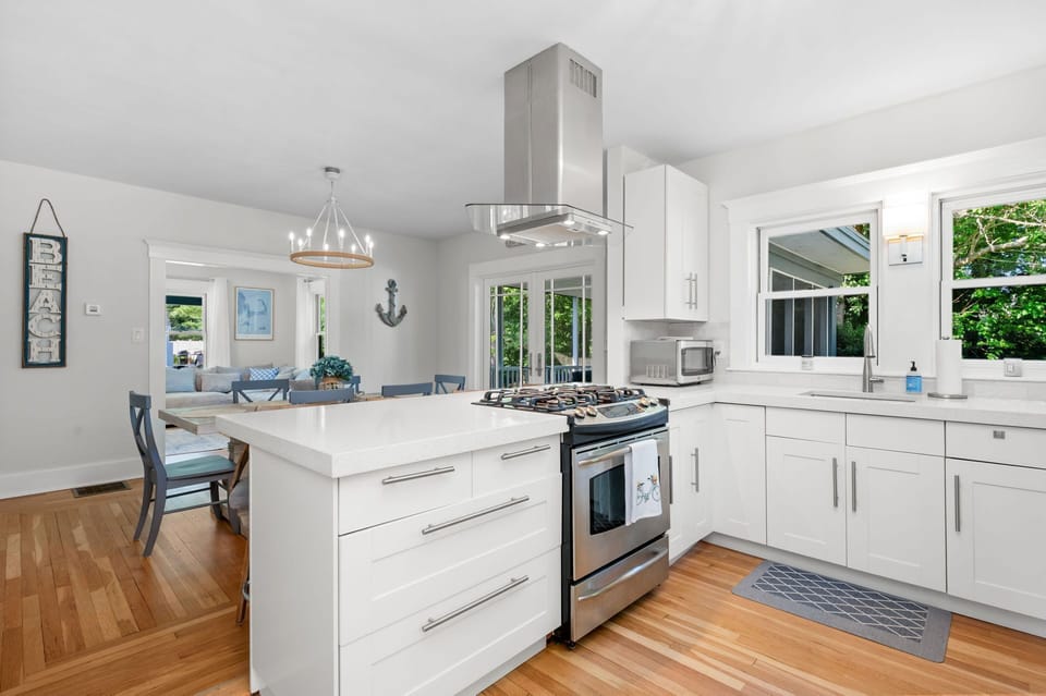 Open floorplan allows the chef to continue the conversation during meal preparation - 232 Wood Road South Yarmouth Cape Cod - Cape State of Mind - NEVR