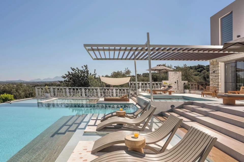 The pool area is equipped with 10 sun beds, side tables, a poolside shower, and 3 umbrellas