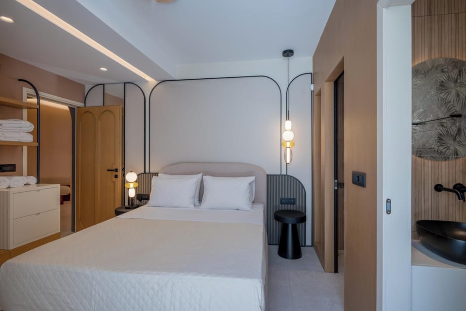 This fourth bedroom features an ensuite bathroom with a stand-up shower