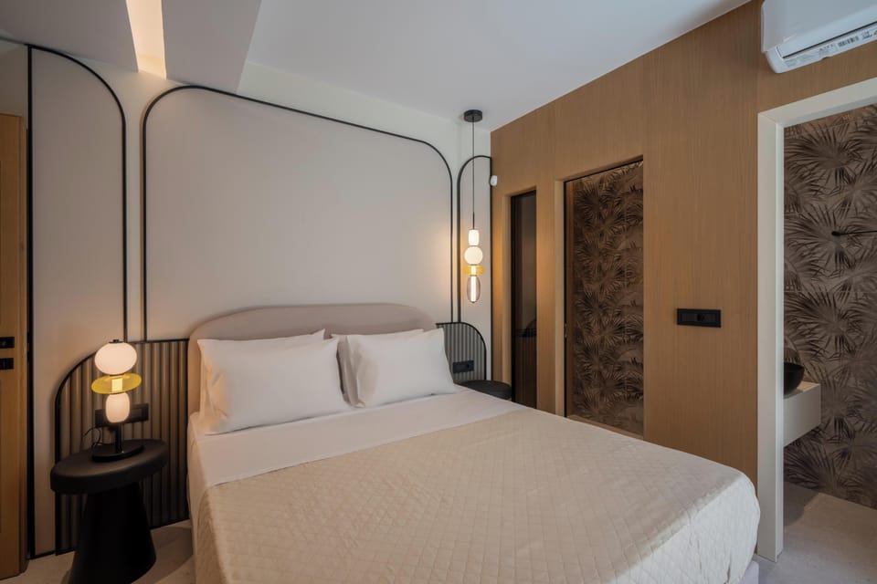 The fourth bedroom features a king-size bed, and is located on the lower floor