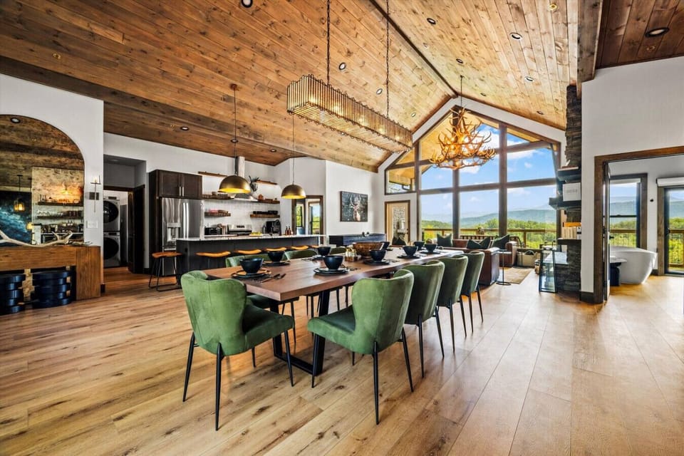 The dining area is conveniently located just off the kitchen. It includes breathtaking mountain views from every seat.