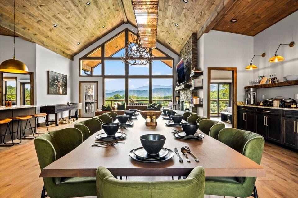 The beautiful wood dining table has plenty of seating for 10 guests. The perfect spot to enjoy a meal together.