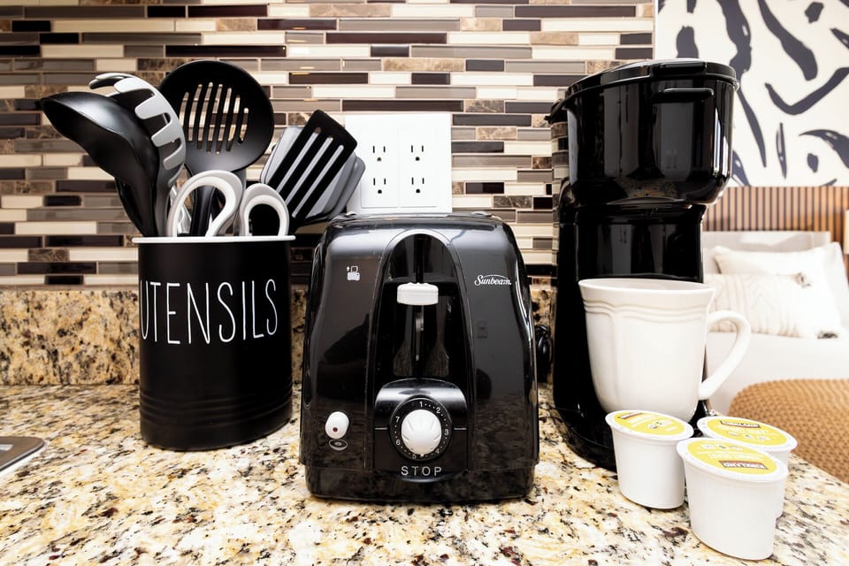 
Full kitchen with freezer, stove, microwave, coffee maker, toaster, air fryer