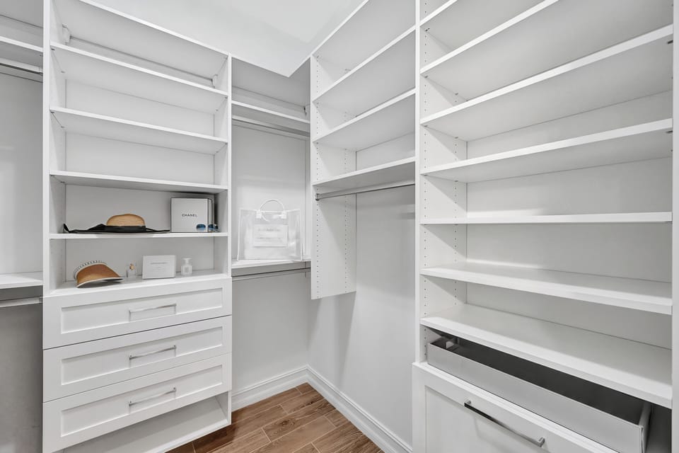 Customized primary bedroom closet. 