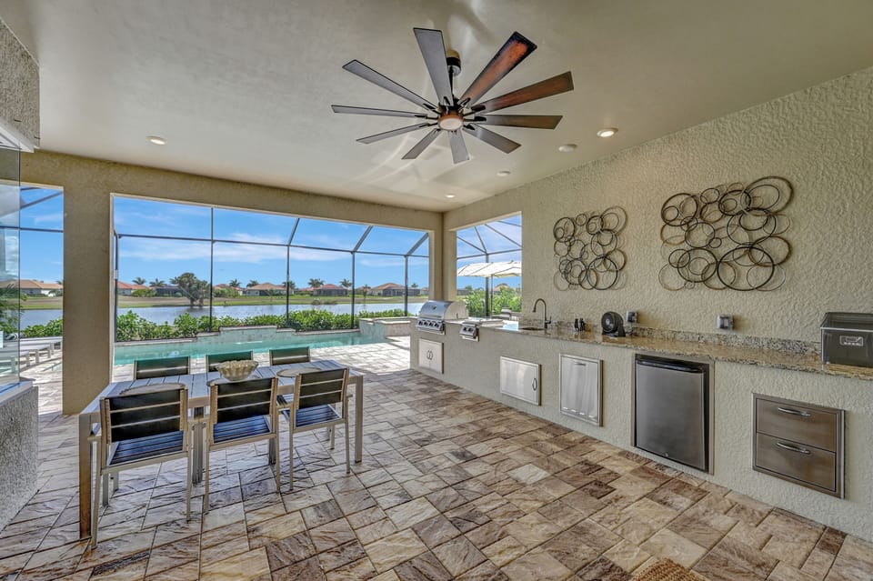 Outdoor retreat with gourmet outdoor kitchen to dine al fresco.