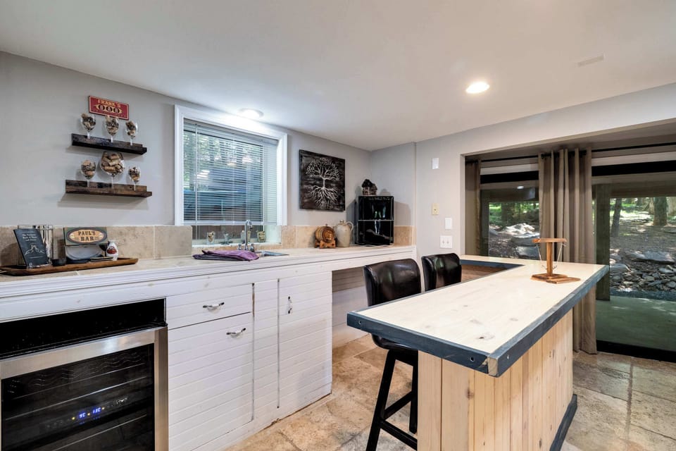 Pour a glass from the wine fridge and pull up a stool at your own private bar.