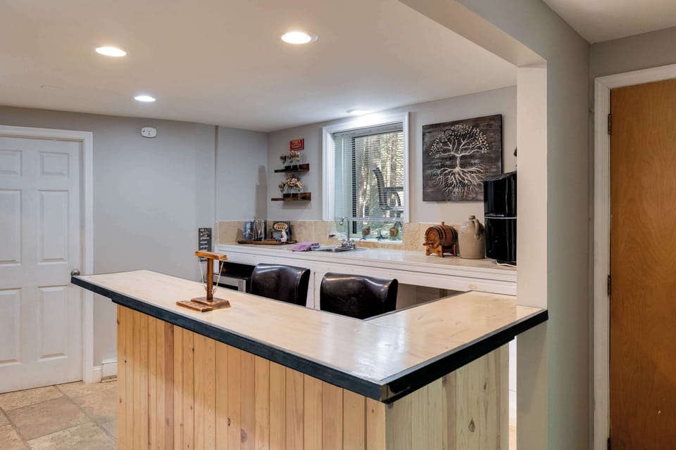 Mix up cocktails at your wet bar before the group heads back to the game table.