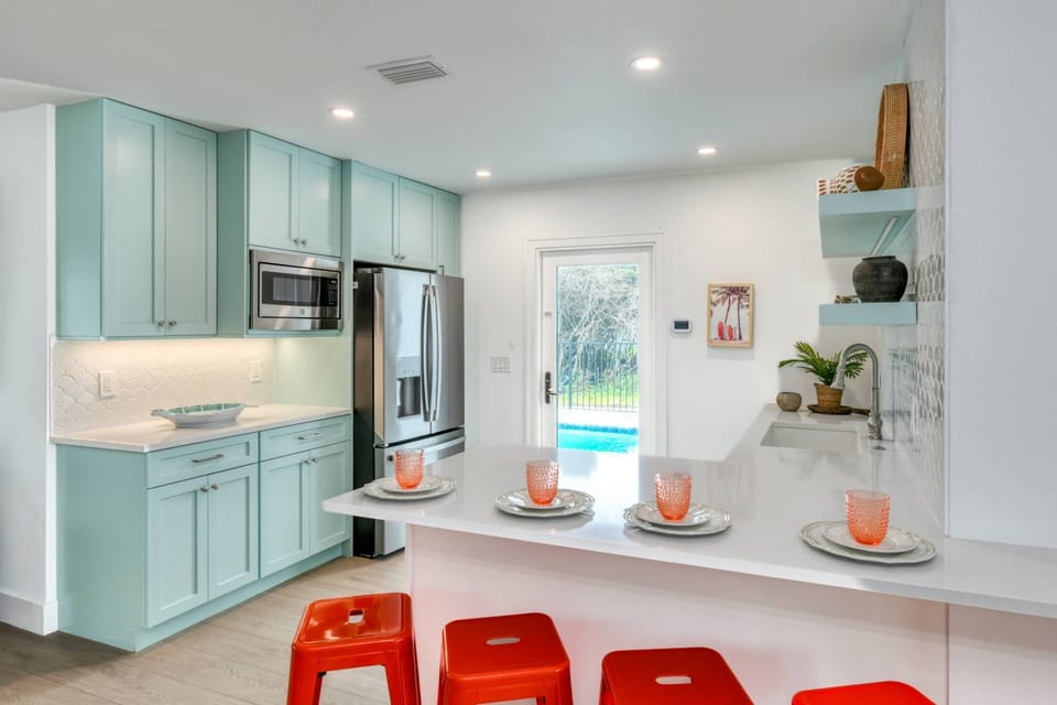 The adorable kitchenette is a great place to prepare a quick meal or snack to enjoy at the counter before you head outside to so much fun in the sun.