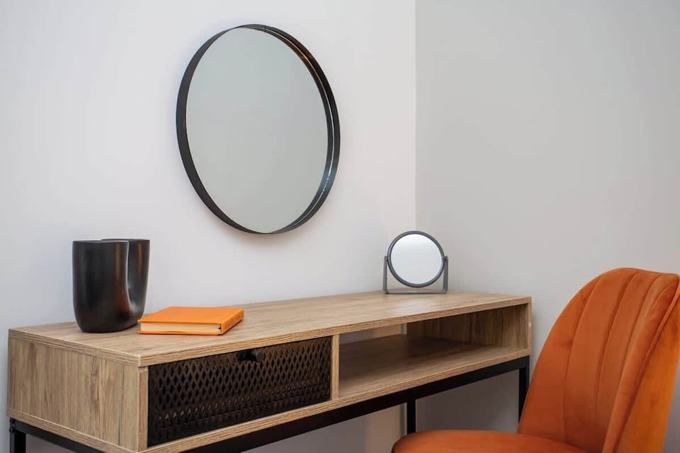 Additionally, a reading table and chair create a cozy corner for work or leisure, making this bedroom a peaceful retreat after a day of exploring South Shields.