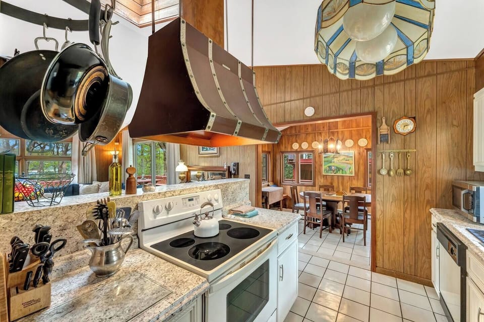 Kitchen: Retro elegance meets modern convenience with stunning details and nature views!