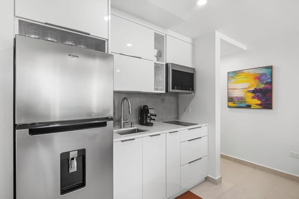 Modern white cabinetry with stainless steel appliances