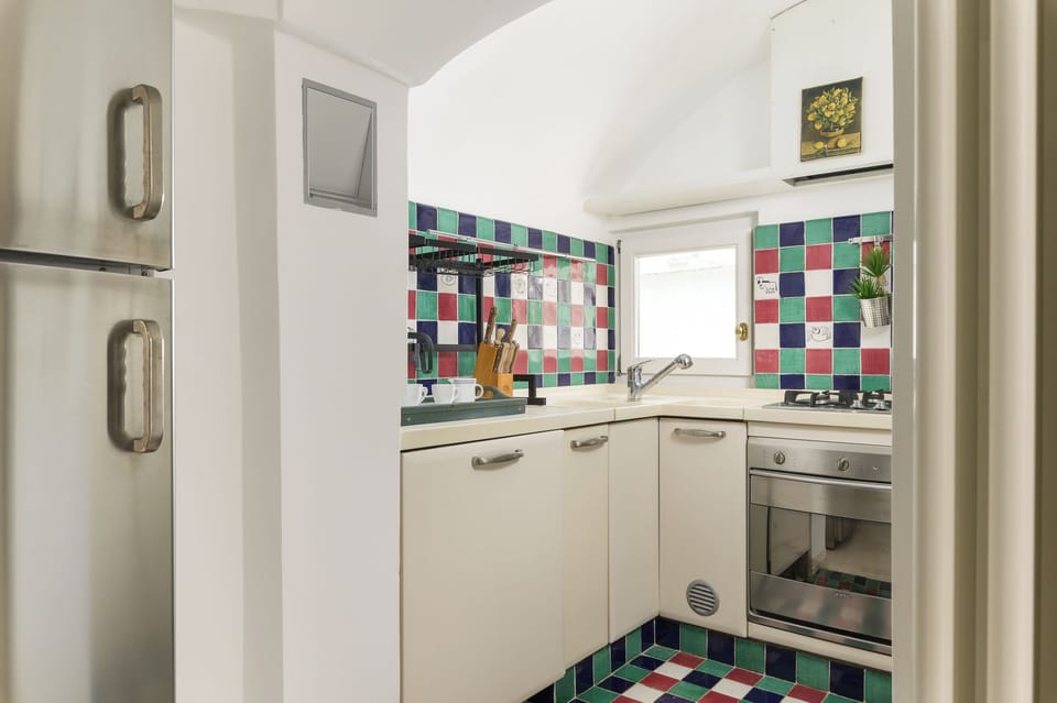 Apartment, Partial Sea View | Private kitchen | Espresso maker, electric kettle, dining tables