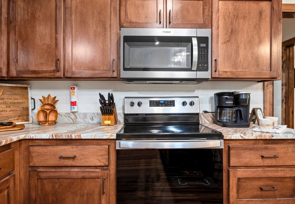 Our kitchen is designed with attention to detail, featuring a sleek sink and charming decor
