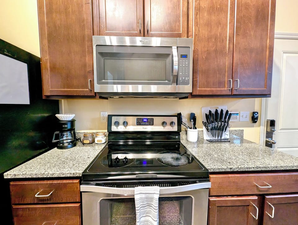 The kitchen features spacious countertops, offering ample room for meal prep.
