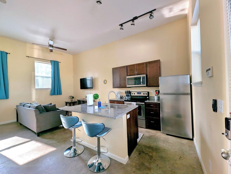The kitchen features spacious countertops, offering ample room for meal prep.

