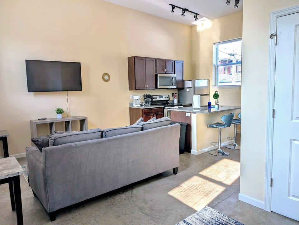 The cozy living room is designed for relaxation and entertainment.
