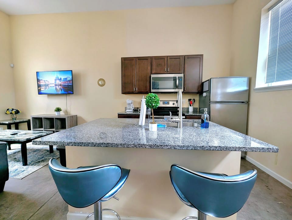 The kitchen features spacious countertops, offering ample room for meal prep.
