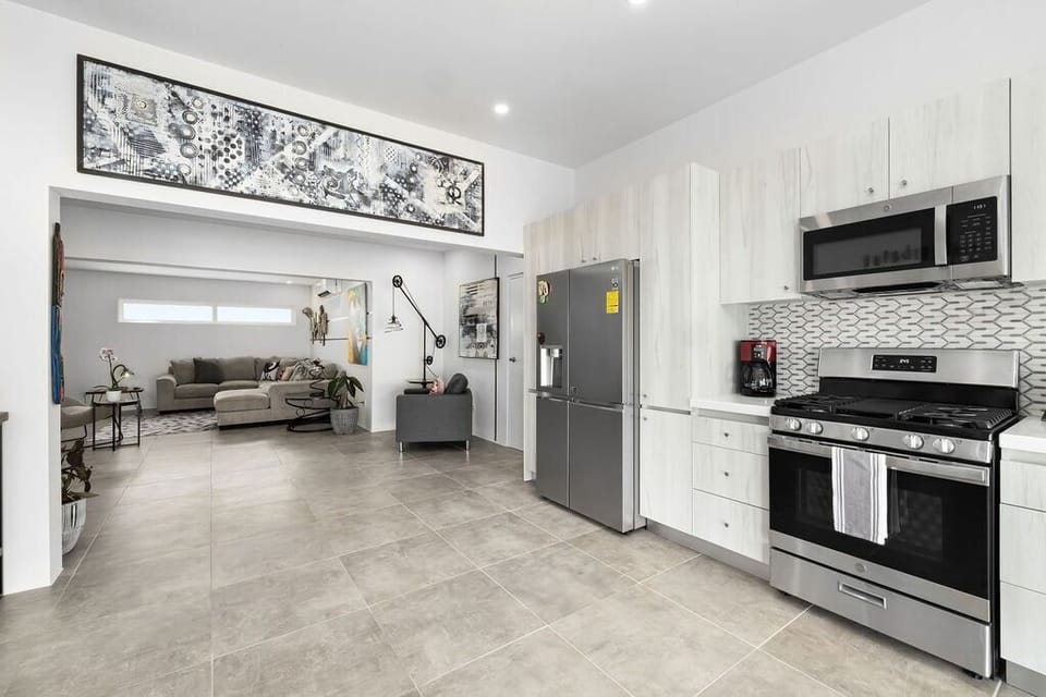 Kitchen 
Experience culinary excellence in our fully-equipped kitchen. From gourmet meals to cozy gatherings, every dish is crafted with love in your home away from home.