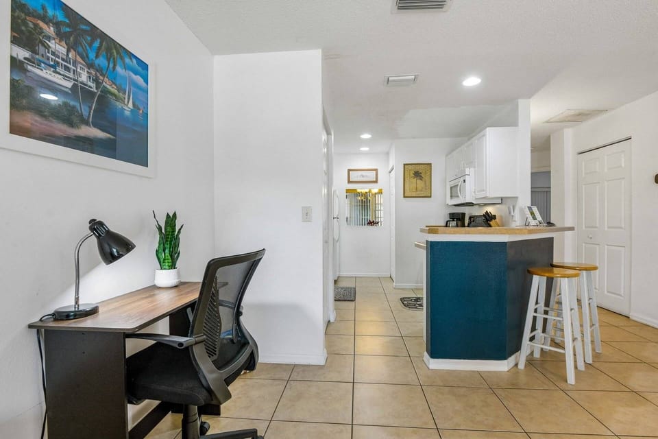 Cozy living area with dedicated workspace—perfect for remote work or planning your next adventure