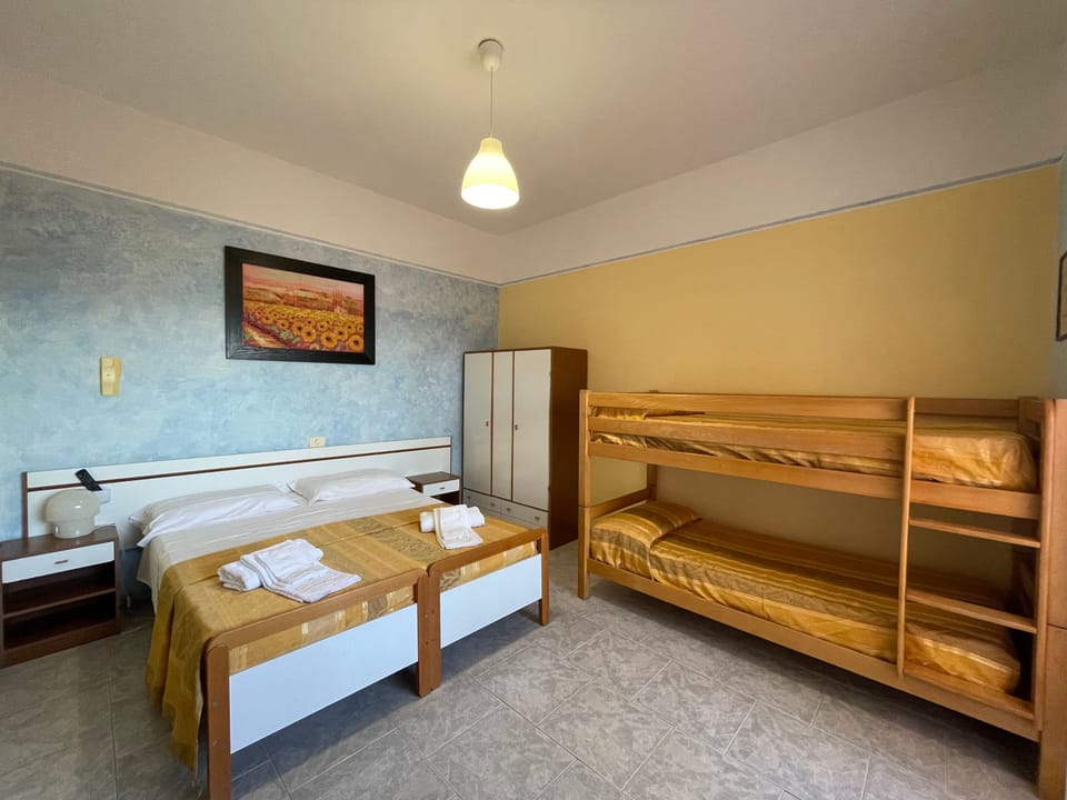 Desk, laptop workspace, free WiFi, bed sheets