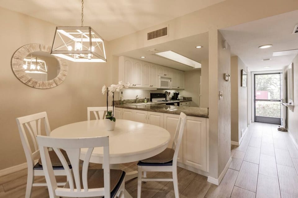 Dining area, looking onto the kitchen and entrance to Condo.