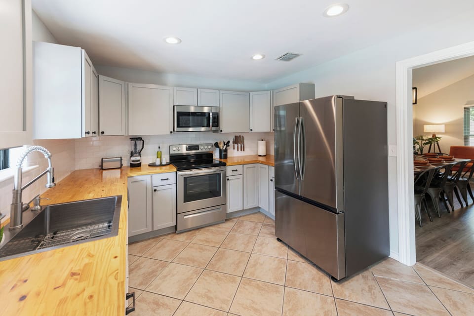 Kitchen is stocked with all the equipment and supplies for big families.