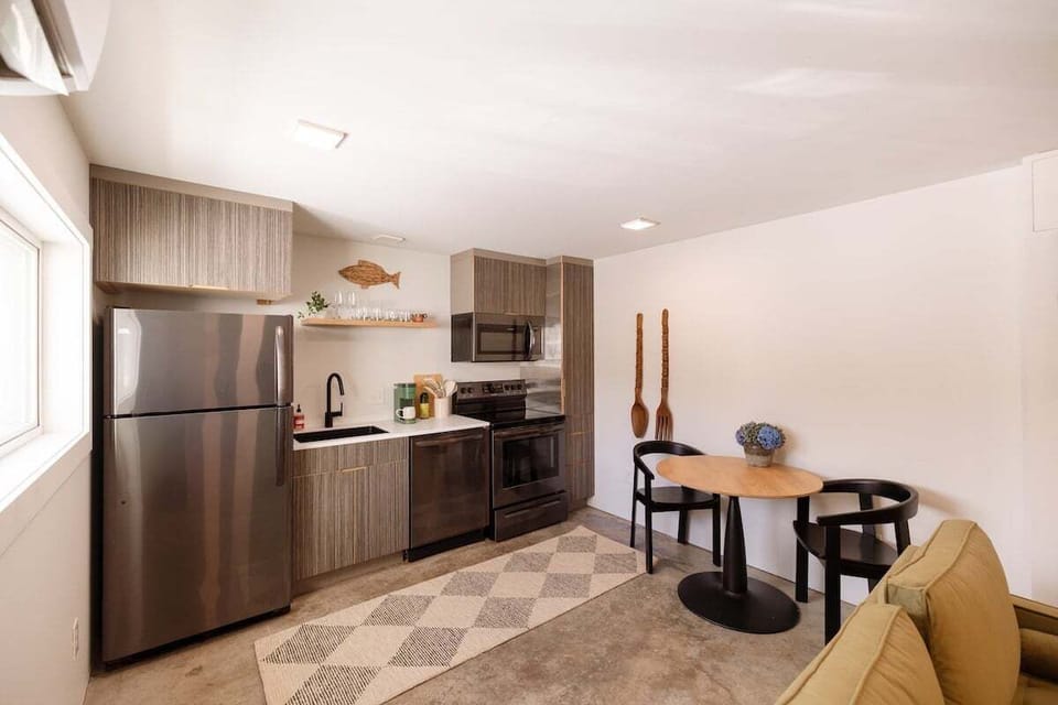 Intimate dining space with seating for two, perfect for enjoying coffee, takeout from local restaurants, or a home-cooked meal.