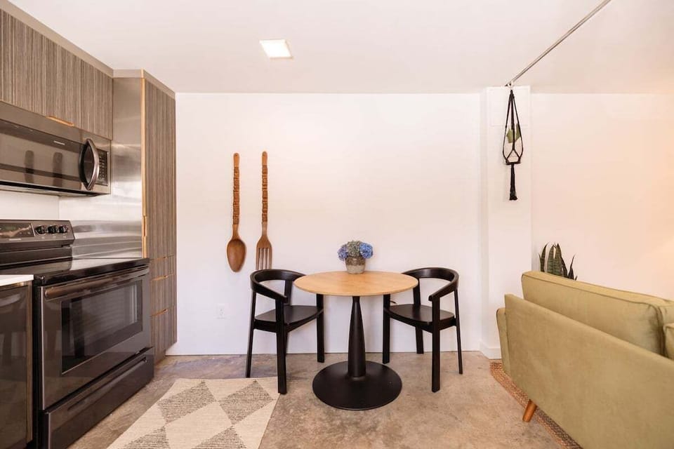 Intimate dining space with seating for two, perfect for enjoying coffee, takeout from local restaurants, or a home-cooked meal.
