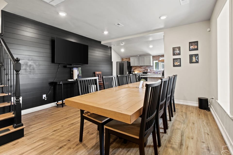 Dining area with large smart TV on the first floor of the main house