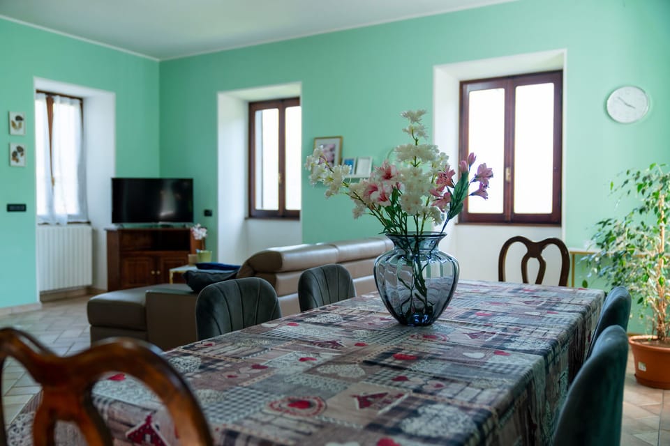 Apartment, Lake View | Living area | 35-inch TV with digital channels