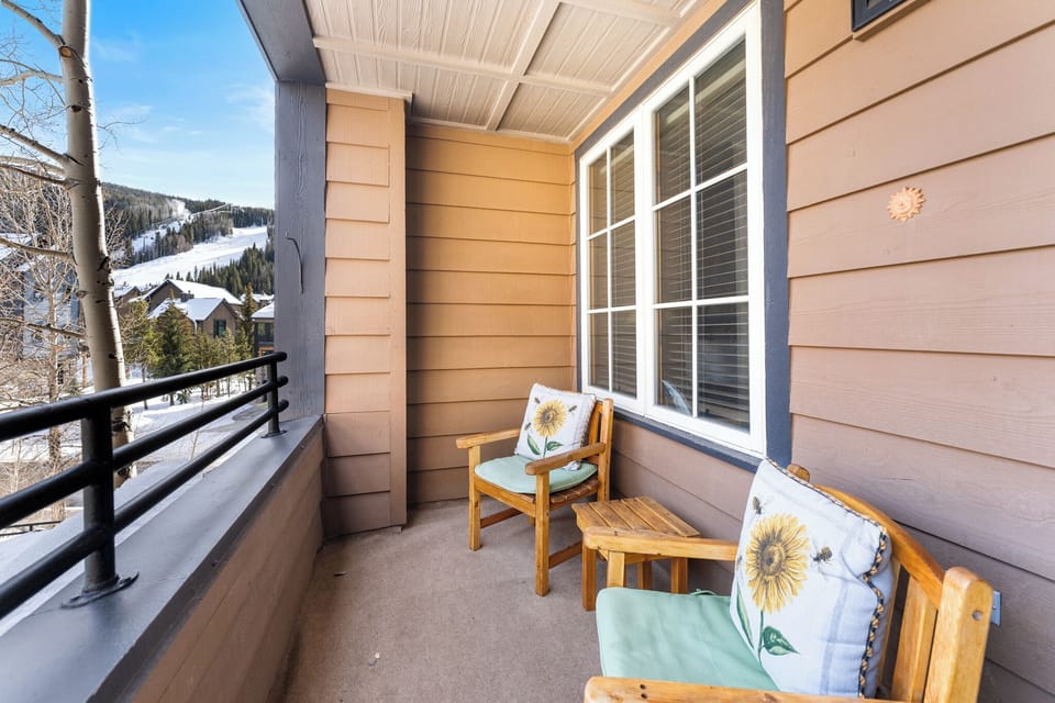 Private balcony with outdoor seating, overlooking the outdoor pool.